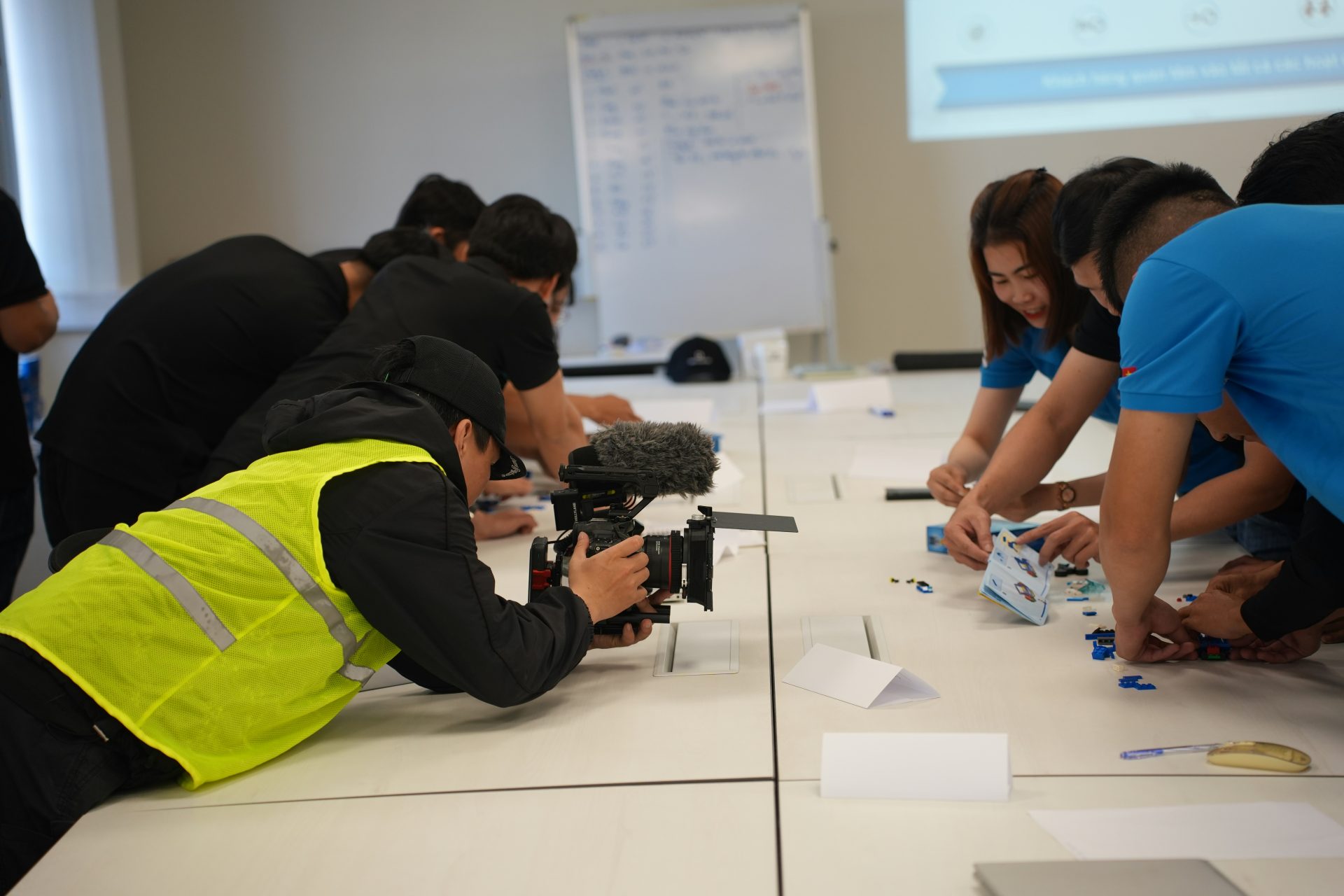 Group of people working on a project at a table.