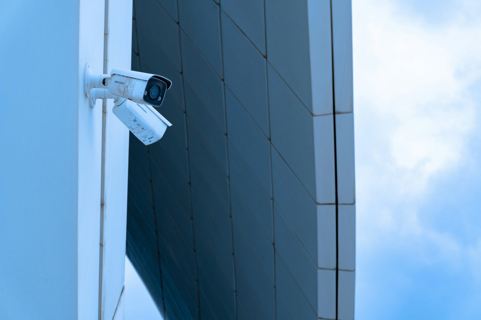 Security cameras are mounted on the building's wall.